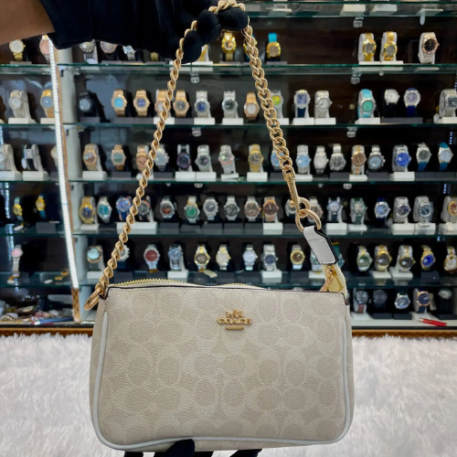 Coach notila 19 signature canvas sling bag