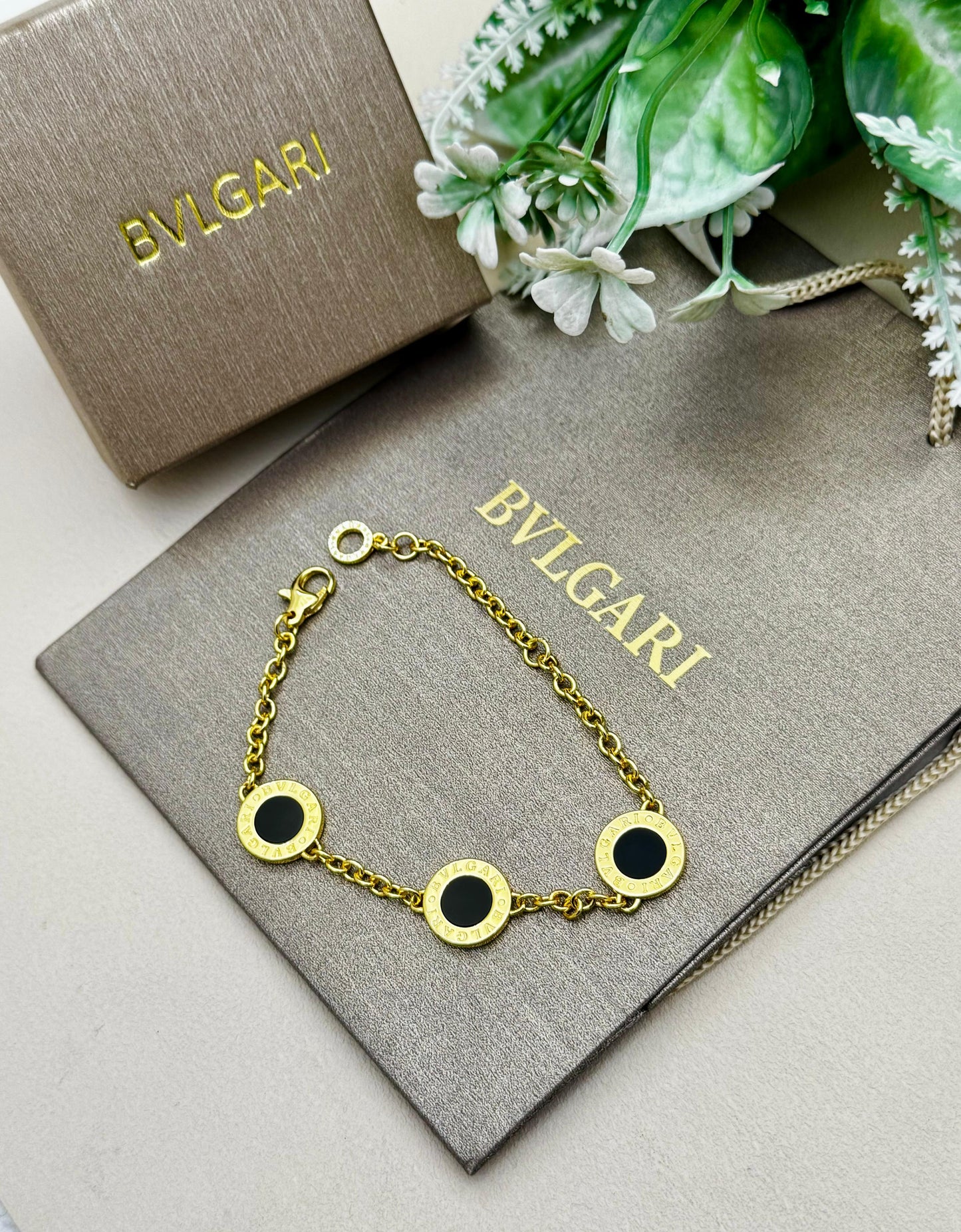 BVLGARI Iconic Disc Charm Bracelet – Black & Gold Edition