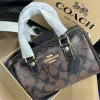 21.png Front view of Coach Mini Rowan Crossbody Bag in signature canvas