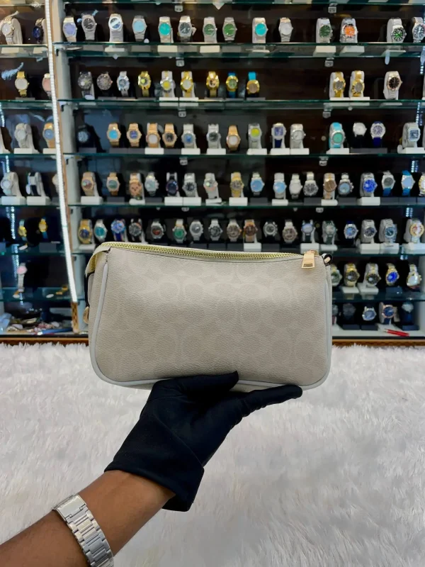 Coach Notila 19 Signature Canvas Sling Bag front view