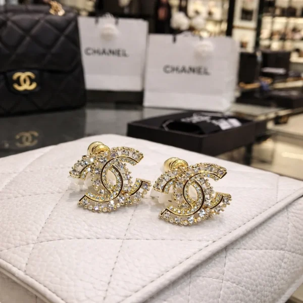 ChatGPT_Image_Apr_11_2026_03_01_33_PM.png Chanel Crystal Double C Stud Earrings front view