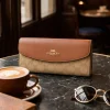 ChatGPT_Image_Mar_11_2026_01_36_40_PM.png COACH THREE FOLD WALLET in black leather