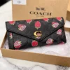ChatGPT_Image_Mar_11_2026_01_46_17_PM.png COACH Three Fold Wallet in black leather
