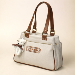 ChatGPT_Image_Mar_19_2026_03_49_57_PM.png Coach New York Canvas Tote Bag with Teddy Keychain