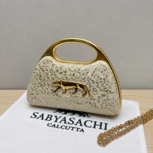 ChatGPT_Image_May_15_2026_03_08_54_PM.png Sabyasachi Elegant Leopard Clutch Bag