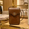 Gemini_Generated_Image_rt6nq6rt6nq6rt6n.png Tory Burch Mobile Sling Bag in white