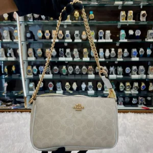 Coach Notila 19 Signature Canvas Sling Bag front view