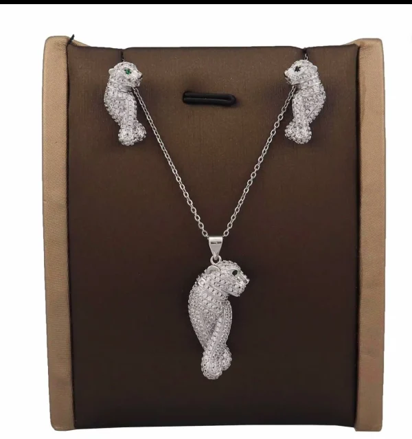 CARTIER beautiful necklace and earring set displayed elegantly