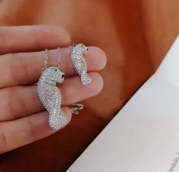 CARTIER beautiful necklace and earring set displayed elegantly