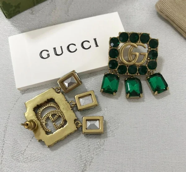 GG Crystal Studded Drop Earrings close-up view