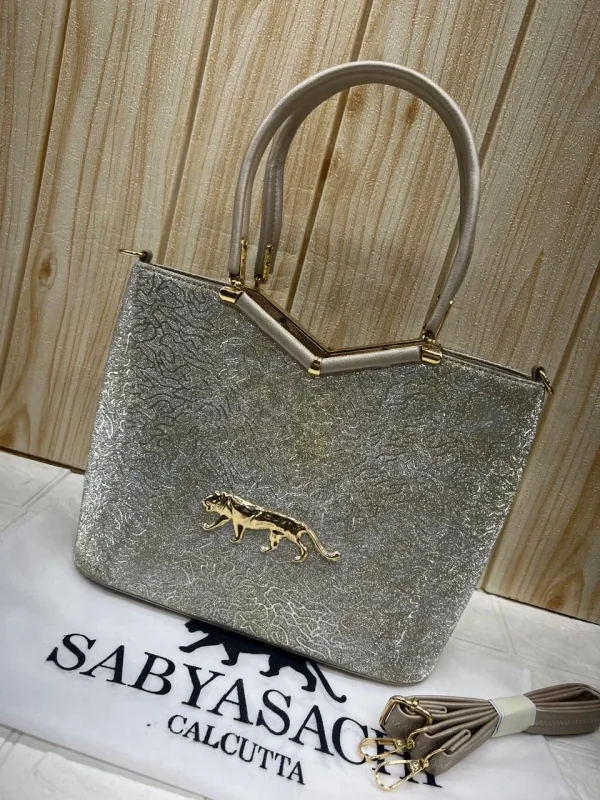 Sabyasachi Metallic Tiger Emblem Handbag front view