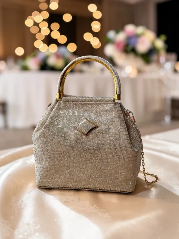 WhatsAppImage2026-03-15at1.37.02PM.jpg Luxury Croco Textured Potli Bag with Gold Handle - Front View