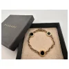 BVLGARI Iconic Disc Charm Bracelet in black and gold