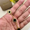 BVLGARI Iconic Disc Charm Bracelet in black and gold