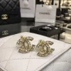 WhatsAppImage2026-04-10at9.59.42AM.jpg Chanel Crystal Double C Stud Earrings front view