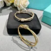 WhatsAppImage2026-04-13at3.54.56PM.jpg Tiffany&Co. Knot Beautiful Bangle on display