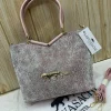 Sabyasachi Metallic Tiger Emblem Handbag front view