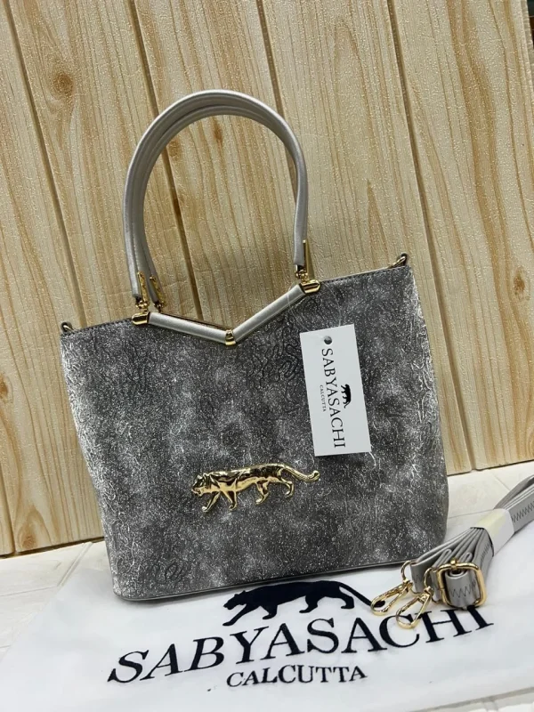 Sabyasachi Metallic Tiger Emblem Handbag front view