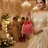 WhatsApp_Image_2026-02-19_at_8.01.25_PM.jpg Luxory Royal Pearl Embroidered Potli Bag front view