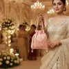 WhatsApp_Image_2026-02-19_at_8.01.26_PM.jpg Luxory Royal Pearl Embroidered Potli Bag front view