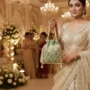 WhatsApp_Image_2026-02-19_at_8.01.30_PM.jpg Luxory Royal Pearl Embroidered Potli Bag front view