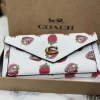 WhatsApp_Image_2026-03-08_at_5.53.55_PM.jpg COACH Three Fold Wallet in black leather