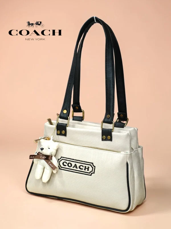 Coach New York Canvas Tote Bag in beige with teddy keychain