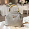 WhatsApp_Image_2026-03-15_at_1.37.03_PM.jpg Luxury Croco Textured Potli Bag with Gold Handle - Front View