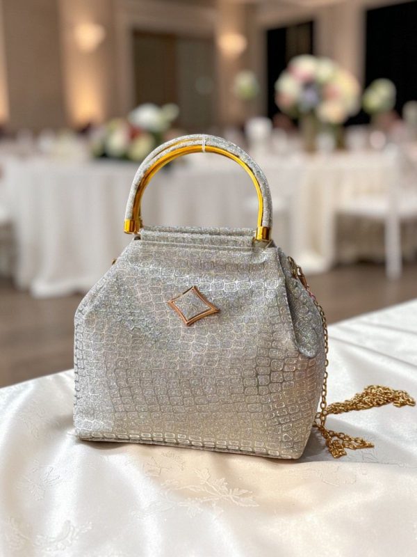 WhatsApp_Image_2026-03-15_at_1.37.03_PM.jpg Luxury Croco Textured Potli Bag with Gold Handle & Chain (Party Edition)