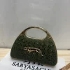 WhatsApp_Image_2026-05-15_at_1.24.01_PM_1.jpg Sabyasachi Elegant Leopard Clutch Bag front view
