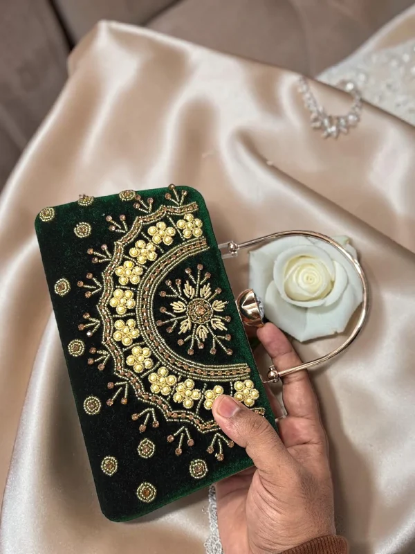 WhatsApp_Image_2026-05-16_at_11.32.42_AM.jpg Elegant crimson velvet bridal clutch with floral embroidery
