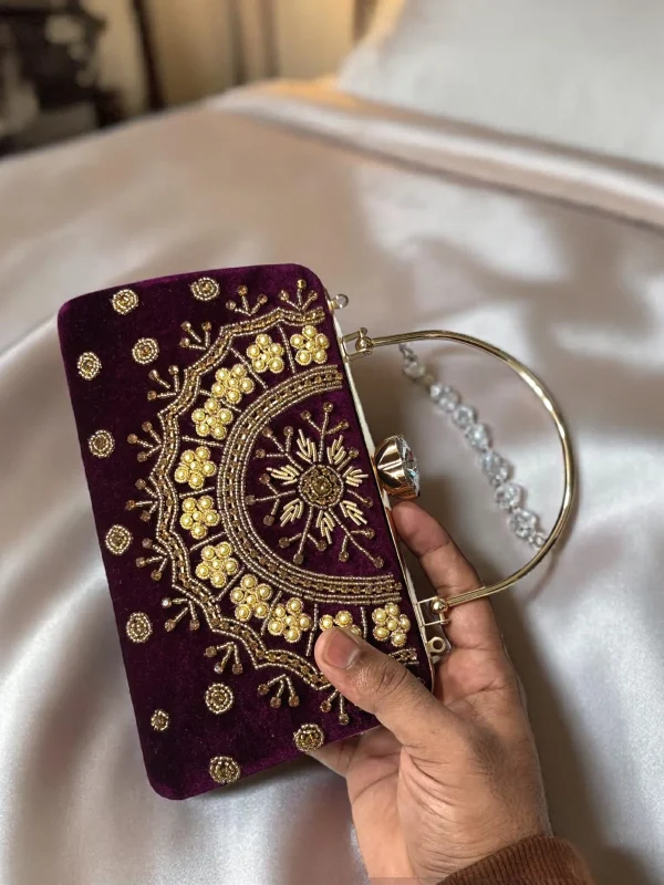 WhatsApp_Image_2026-05-16_at_11.32.44_AM.jpg Elegant crimson velvet bridal clutch with floral embroidery