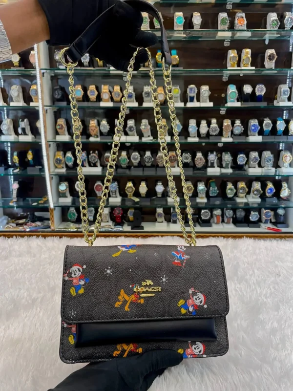 ejMlGyYW_1.jpg Coach Disney Edition Crossbody Sling Bag - Black Body Front View