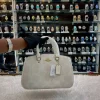 i3EFhBXN.jpg Coach sling bag for girls in white body - front view