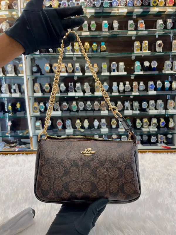 Coach Notila 19 Signature Canvas Sling Bag in Dark Brown - Front View