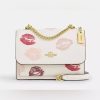 m_67e409fe82dceb3c25250687.jpg Coach klare crossbody kiss sling bag white body