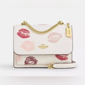 m_67e409fe82dceb3c25250687.jpg Coach klare crossbody kiss sling bag white body
