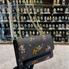 pfFJxl6i.jpg Coach Disney Edition Crossbody Sling Bag - Black Body Front View