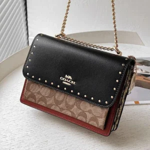 Klare Crossbody Bag in Signature Canvas with Rivets - Front View