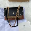 photo_2025-11-22_14-00-26_8.jpg Klare Crossbody Bag in Signature Canvas with Rivets - Front View