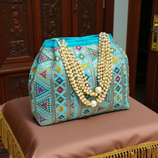 photo_2025-12-15_16-36-35_2.jpg Luxory Traditional Embroidered Potli Bag in vibrant colors