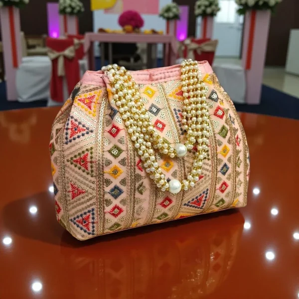 photo_2025-12-15_16-36-35_4.jpg Luxory Traditional Embroidered Potli Bag in vibrant colors