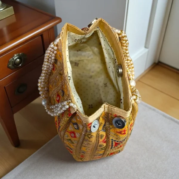 photo_2025-12-15_16-36-35_7.jpg Luxory Traditional Embroidered Potli Bag in vibrant colors