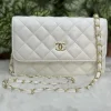 Chanel Quilted Sling Bag in black leather