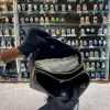 tp0CmqwT.jpg Front view of Coach sling bag for girls in black