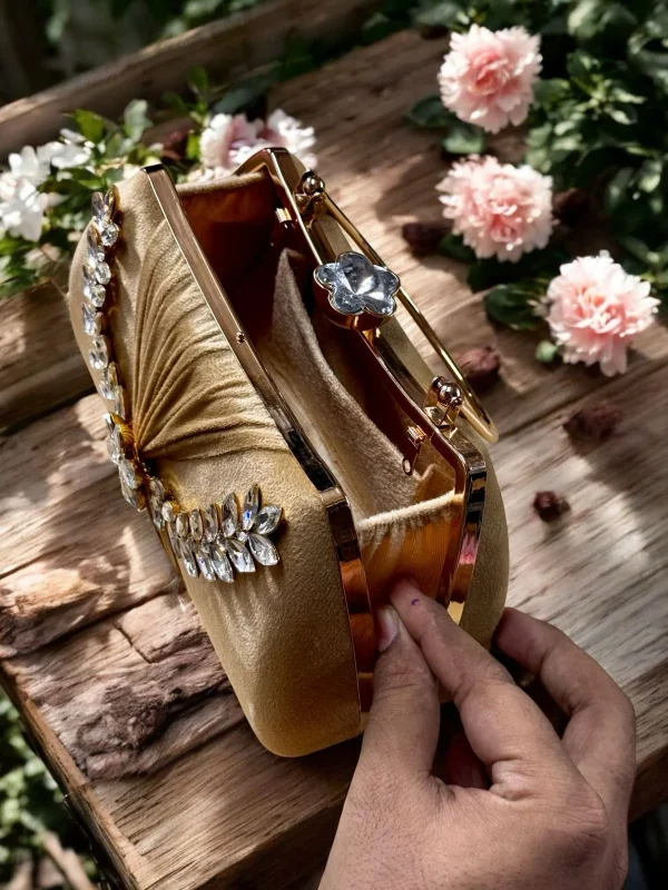 Elegant stone-studded bridal clutch in gold